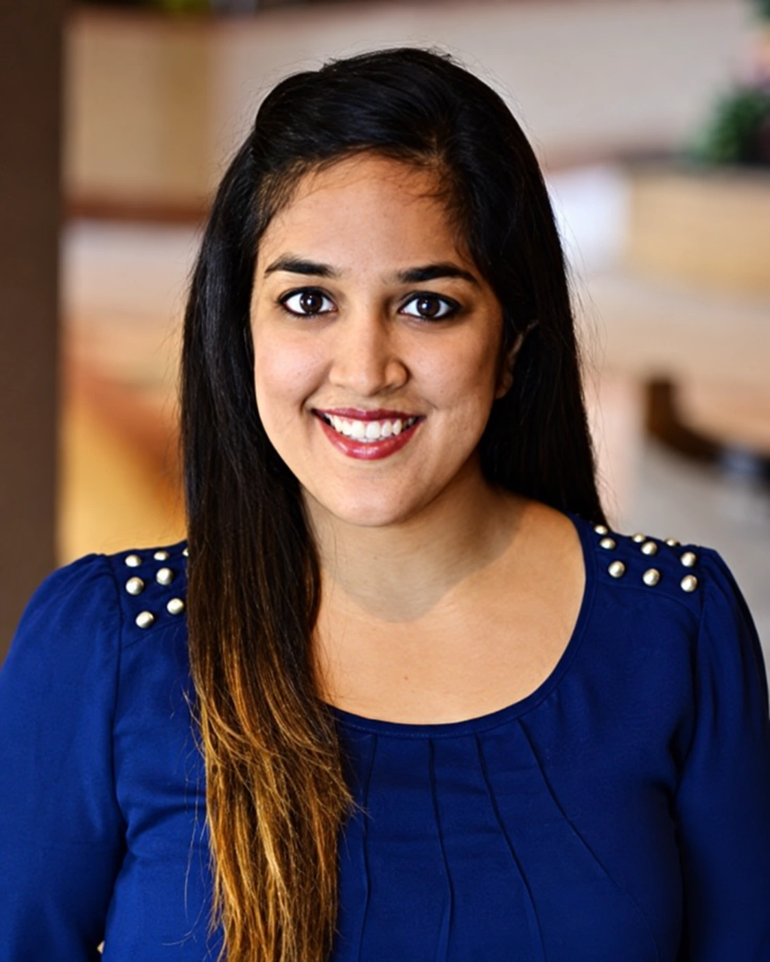 Dr. Sakina Khambaty in her navy blouse, from her original practice portrait