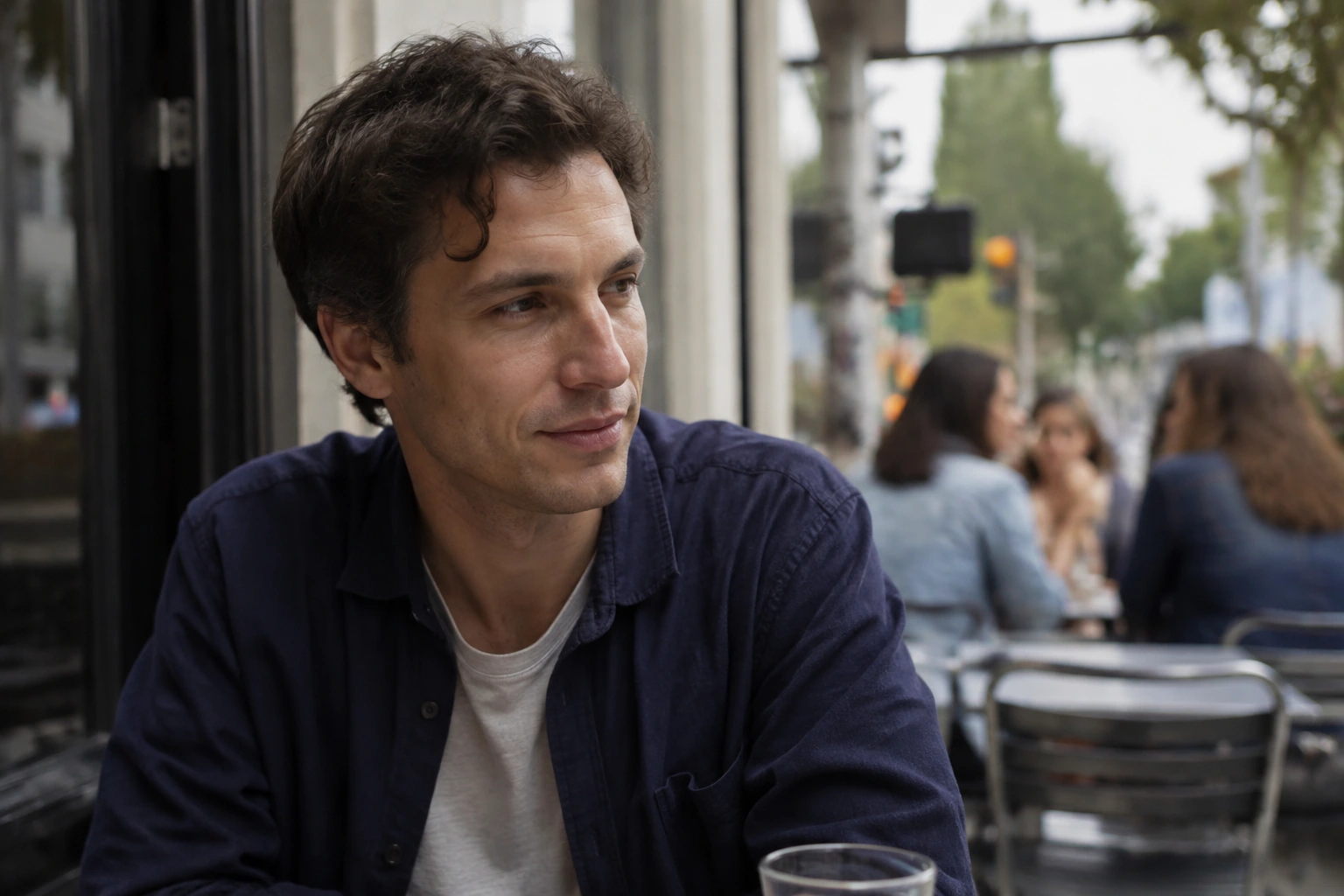 A 31-year-old man with short wavy hair.
