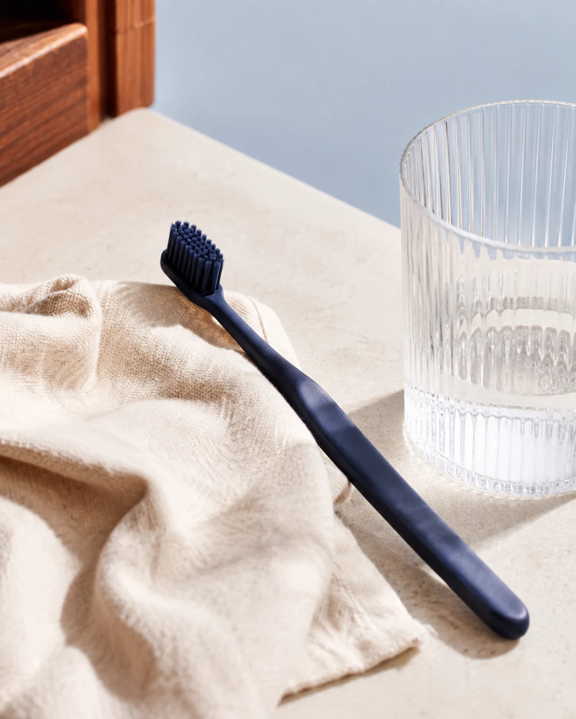 A toothbrush and folded linen, an illustration of everyday dental care