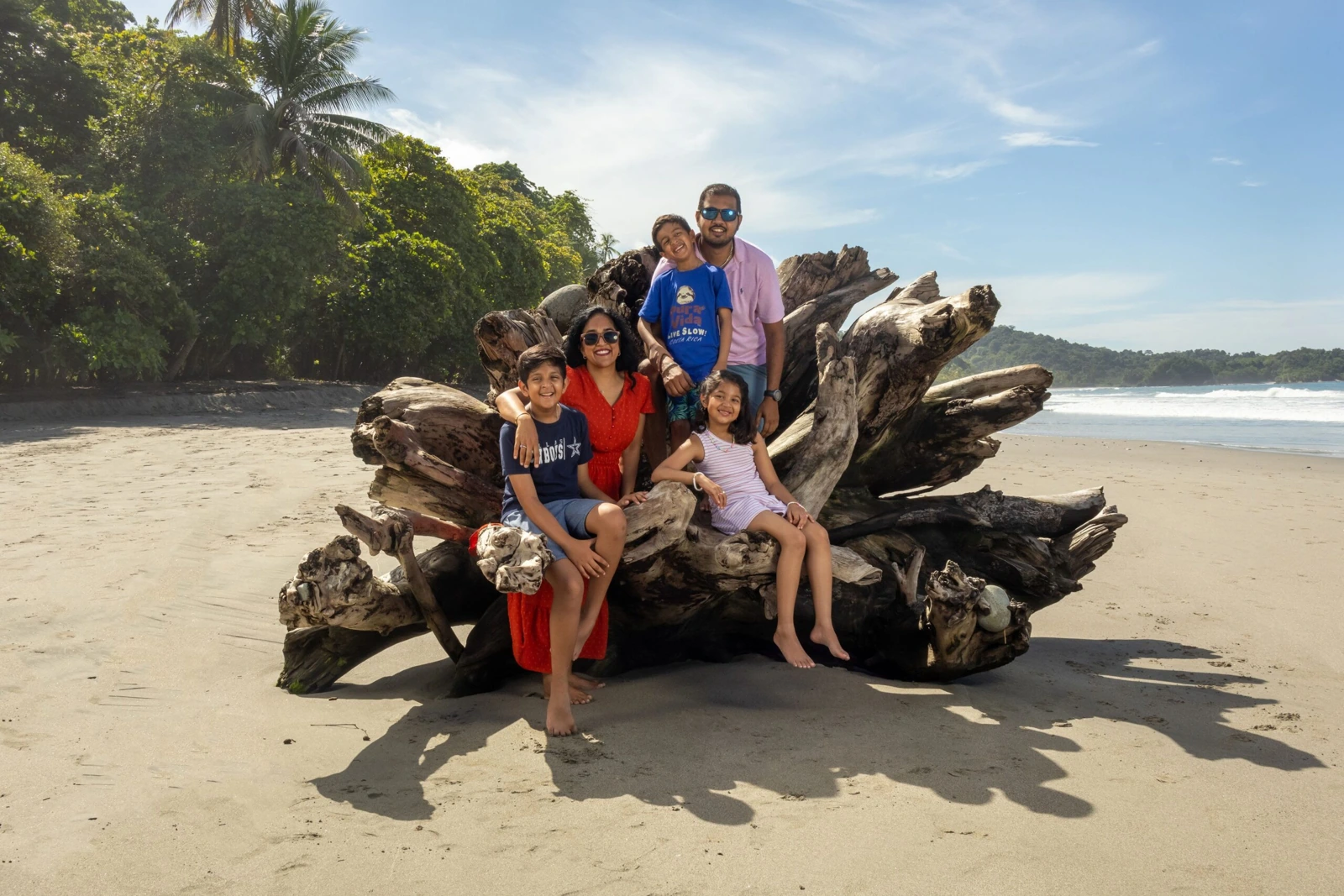 Dr. Khambaty, her husband and their three children together on a beach in Costa Rica